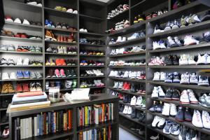 Numerous athletic shoes are on display in the large walk-in shoe closet of the Golden State Warrior's Andre Iguodala at his home in Berkeley, CA, on Thursday, January 8, 2015.